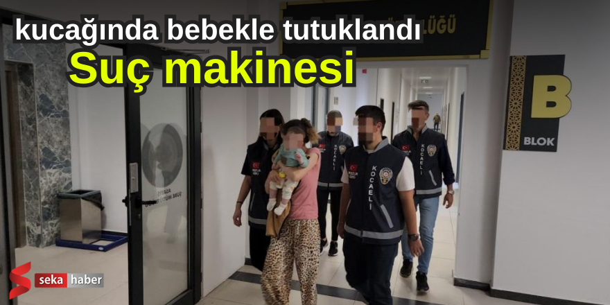 Suç makinesi kucağında bebekle tutuklandı